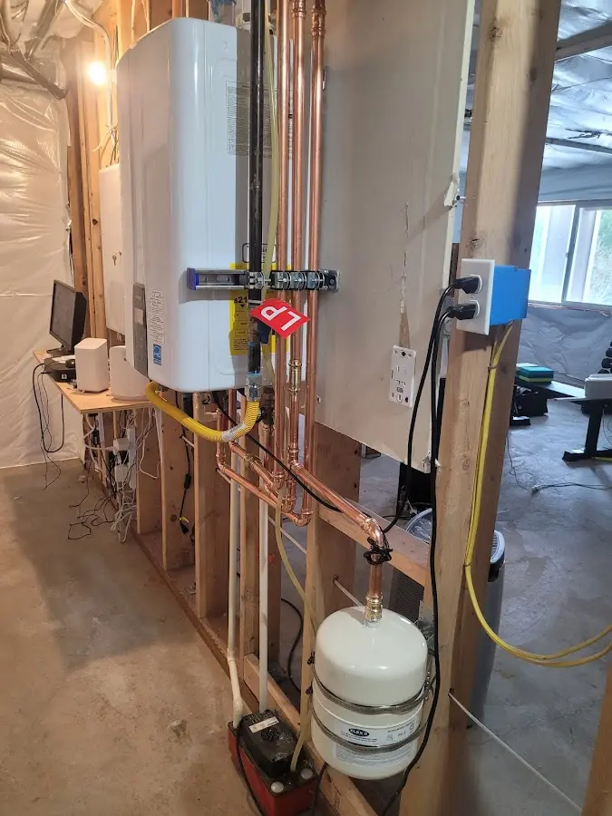 Licensed plumber repairing a kitchen sink in Green